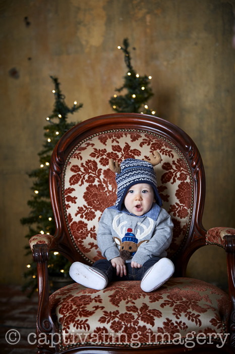 baby boy in big antique chair
