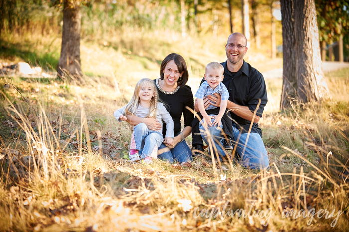 family at sunset in tall grasses