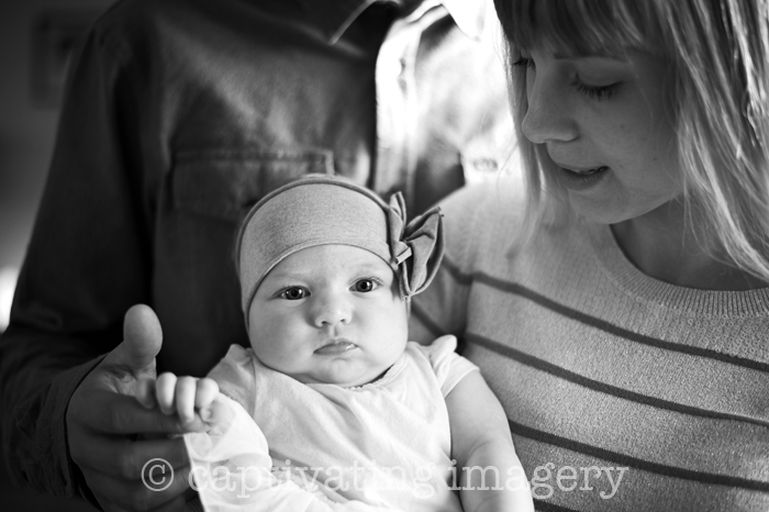 baby girl with parents close-up