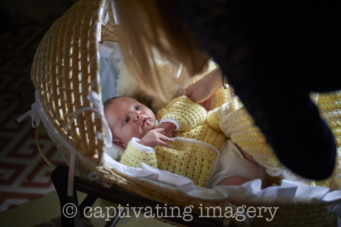 baby in Moses bassinet