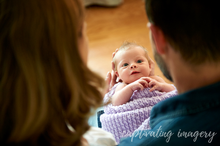 parents looking over their baby