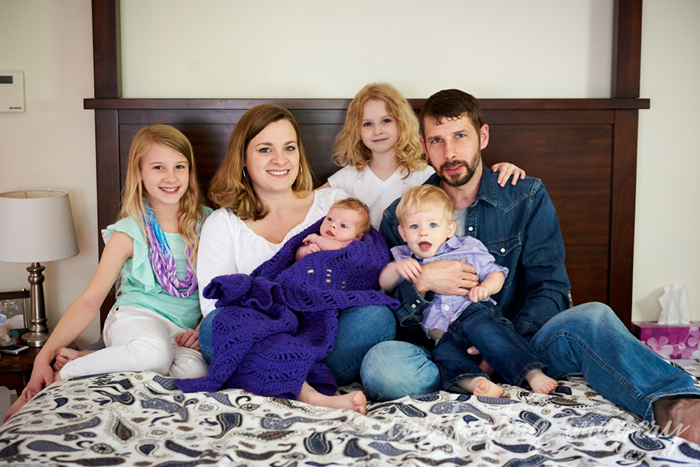 family portrait on the bed