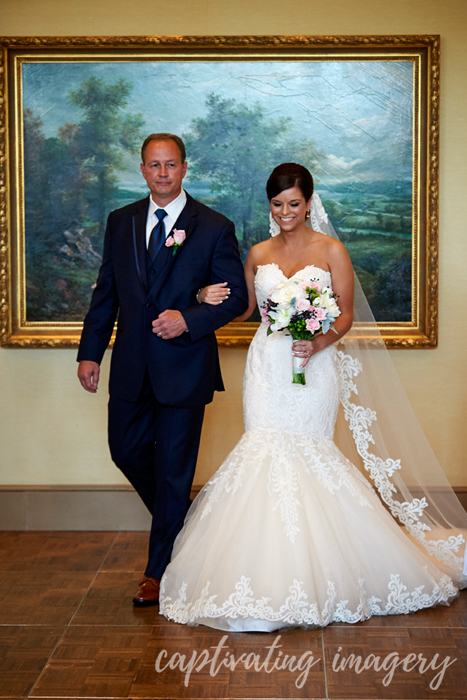 father walking daughter down the aisle