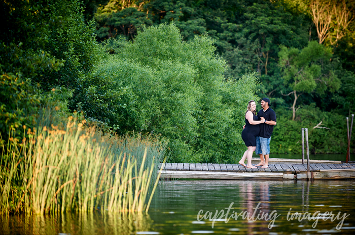 kissing on the dock of the lake