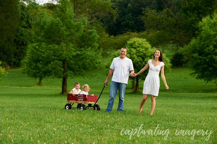 family portrait with kids in a wagon