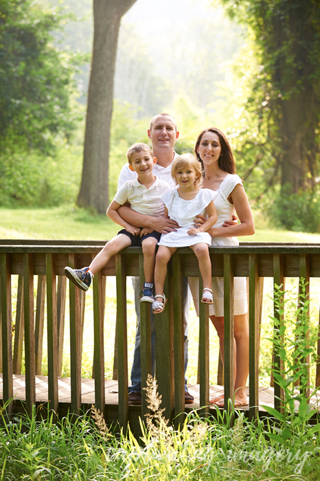 family on a wooden bridge