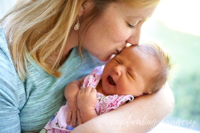 mommy kissing baby