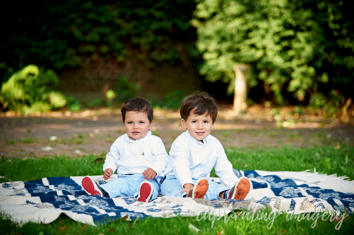 boys seated on the blanket