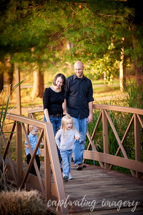 family walking across the bridge