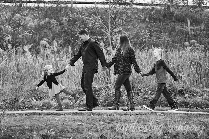 walking family holding hands