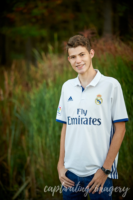 high school senior in soccer jersey