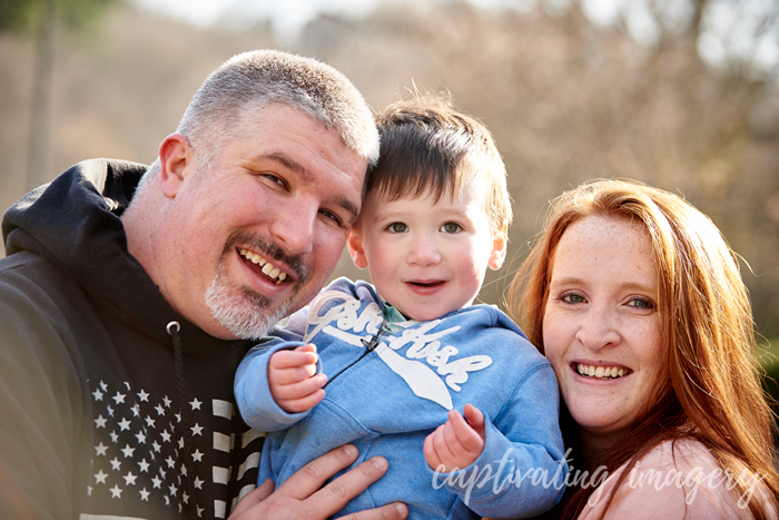 close up of mom, dad and son