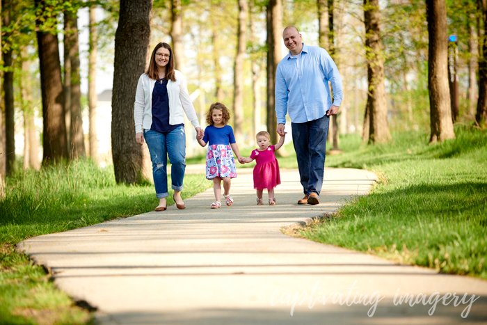 family walking holding hands