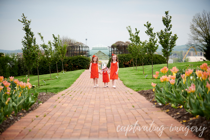 three sisters walking in garden