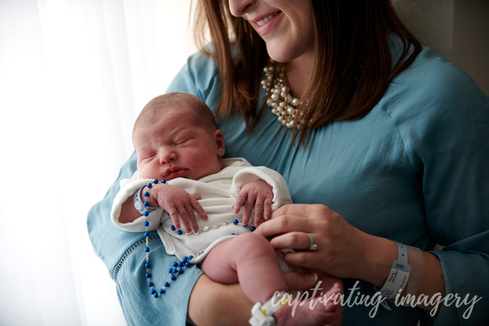 babe in mama's arms