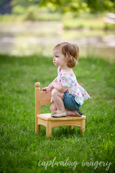 little girl sitting on a chair