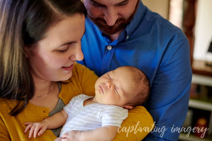 parents admiring their baby