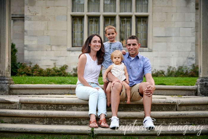 family portrait by the mansion