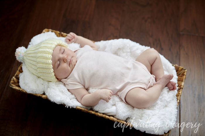 baby sleeping in basket