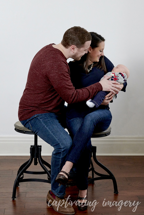 parents admiring baby