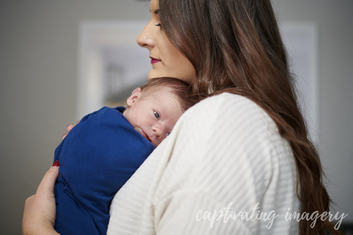 mom holding baby