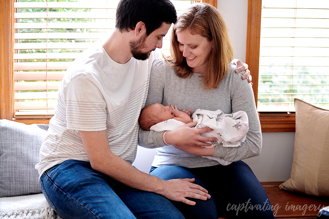 family together on window seat