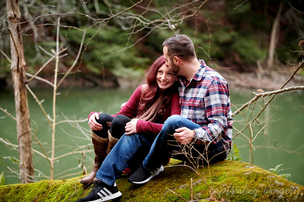 man kisses his fiance's forehead