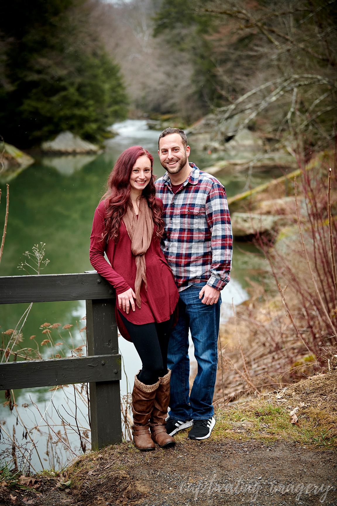 couple standing by creek