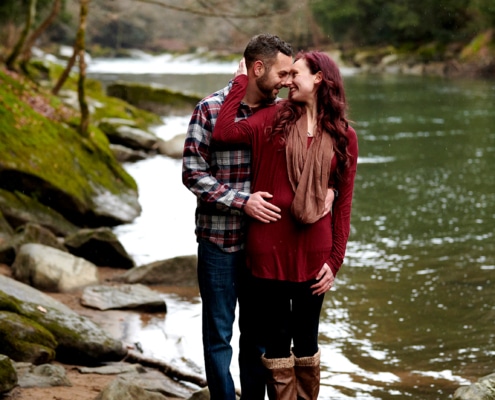 couple stands by creek
