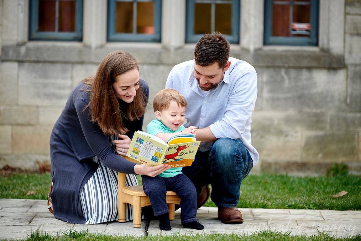 parents reading to boy