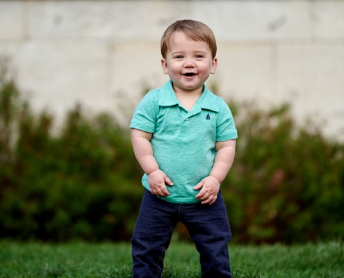 boy smiling and standing