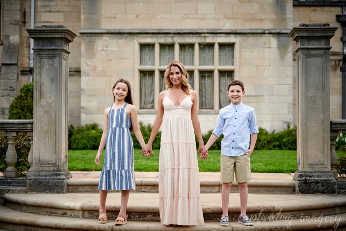 mom and children hold hands