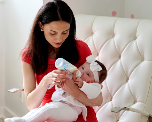 mom feeding baby girl