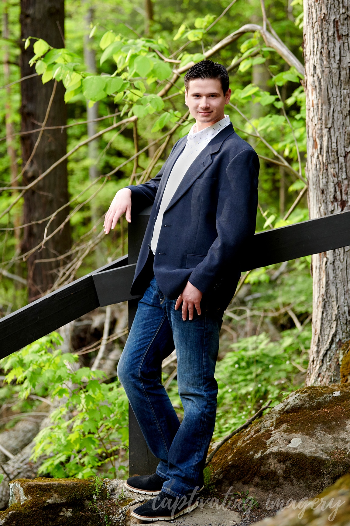 boy in suit jacket on hiking path