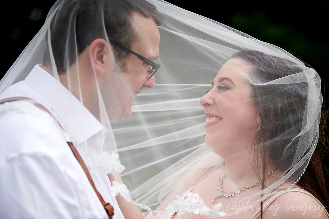 couple portrait with veil