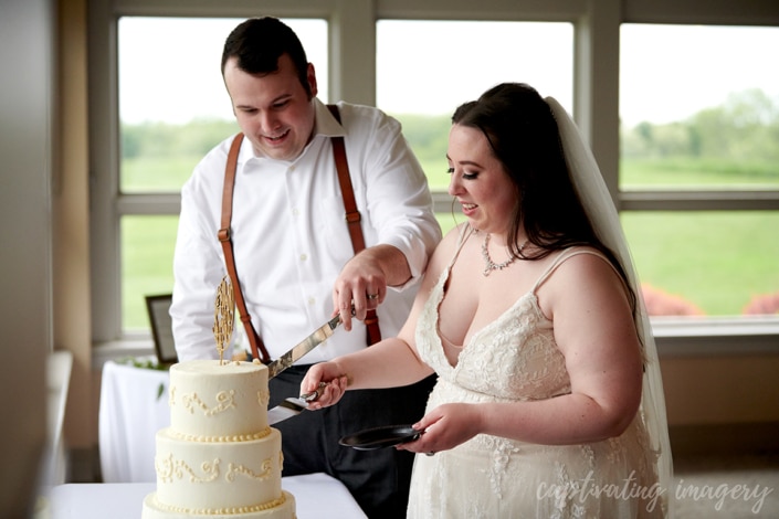 married couple cut the wedding cake
