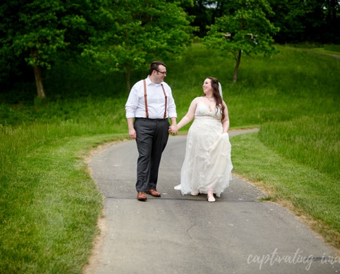 married couple holding hands portrait