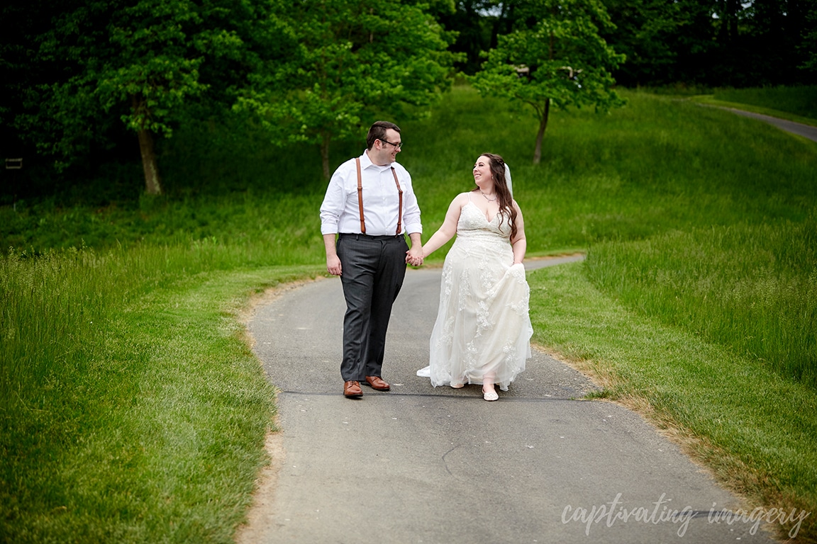 married couple holding hands portrait