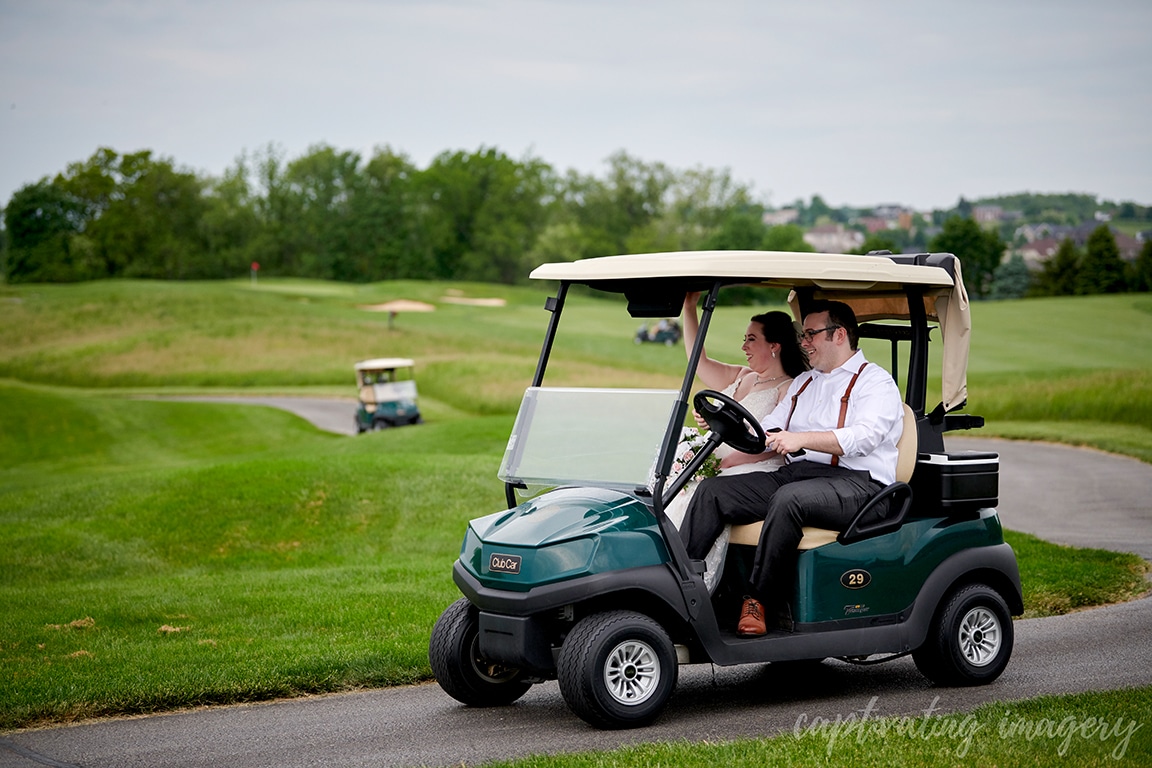married couple on golf cart
