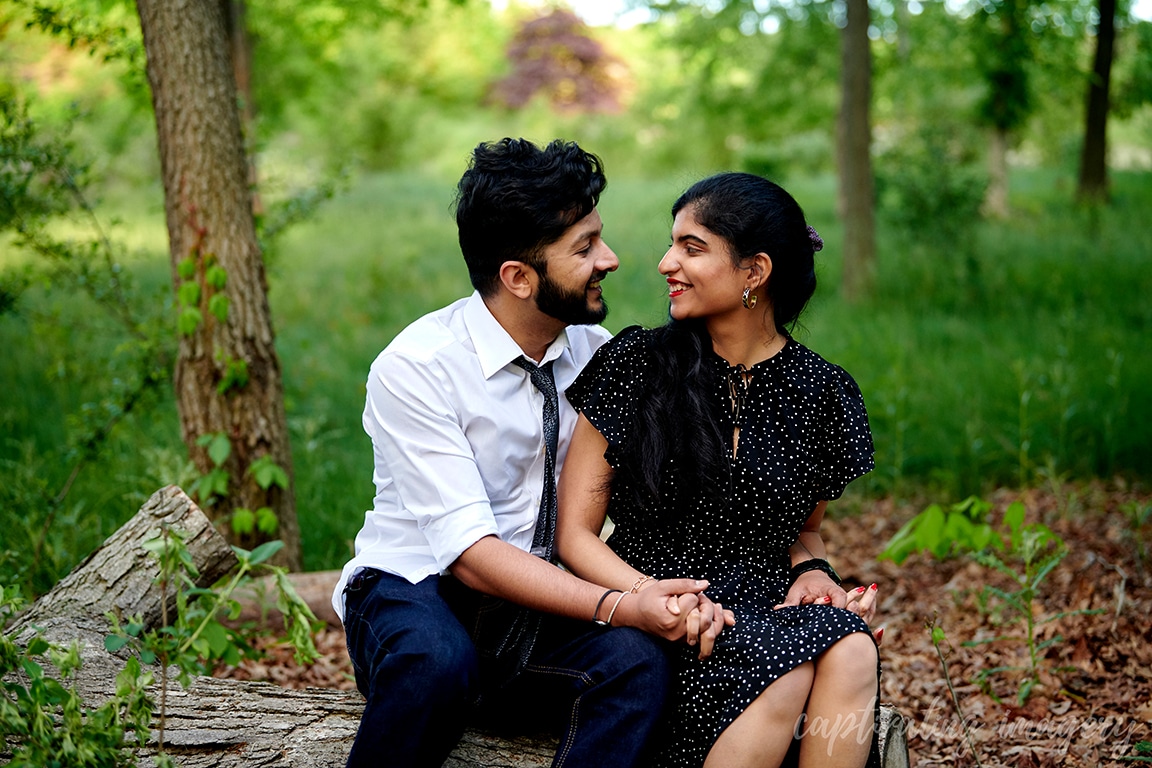 couple sit looking at one another