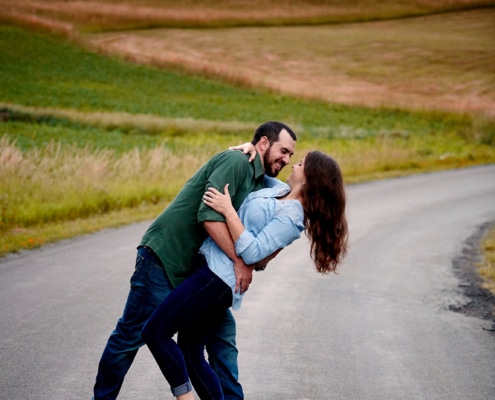 couple dances in front of sunset