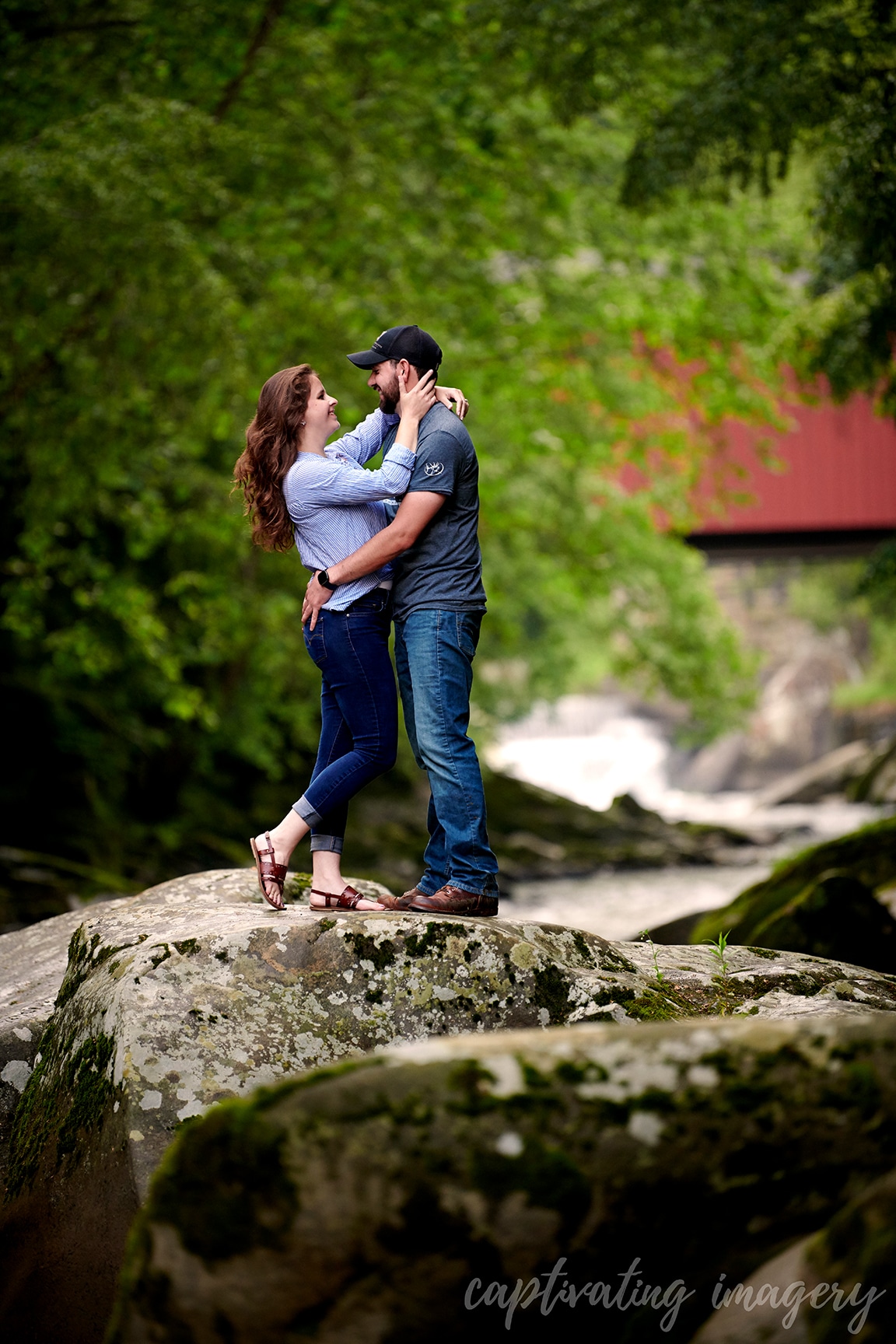 couple embraces on rocky terrain