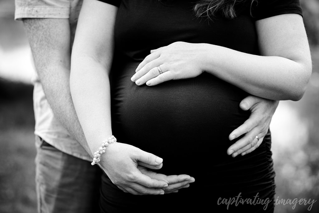 close-up of parents' hands