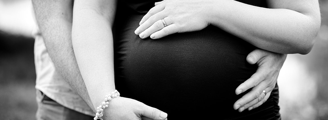 close-up of parents' hands