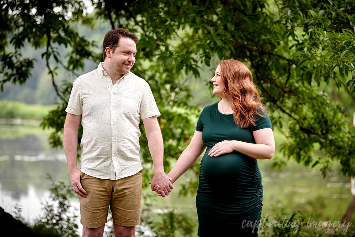 parents-to-be holding hands